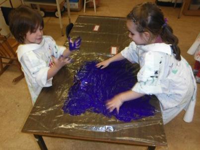 Session Two Cover tables with plastic. Students work in pairs Put a squirt of black paint on the plastic between each pairs Finger paint on the plastic covered table top using the black paint.