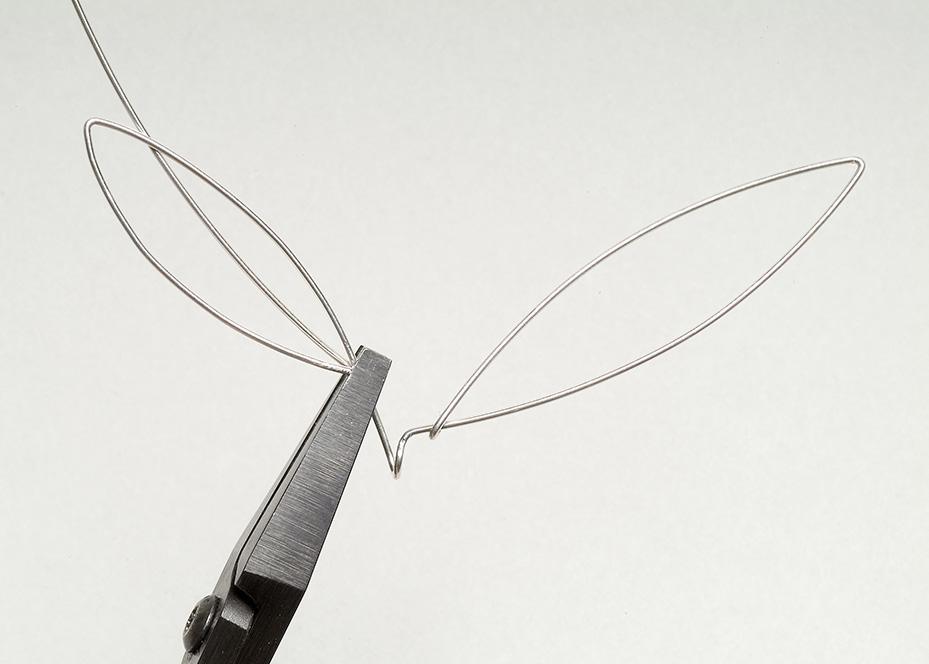 arefully pull the end of the wire through the leaf shape from the back to the front. Make a small hook at the end of the wire.