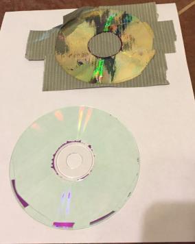 Cut the now clear CD into 4 sections then trim each section to fit on the inside of the other end cap. Hot melt glue it to the end cap with what was the label side facing the endcap.