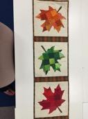 OCTOBER October 12th at 1:00 or 6:00 Fabric Swap Leaf Table Runner. Louise did it before and she is doing it again. Having everyone share fabric to create these lovely leaves.