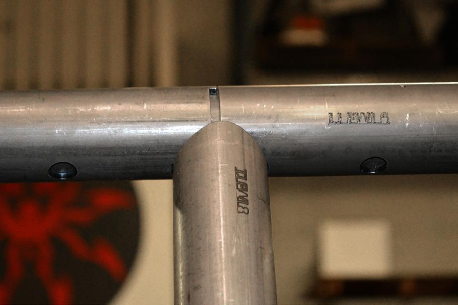 Insert the other end of the Header Bar Sleeve into the Header Bar that was set into place in a previous step.