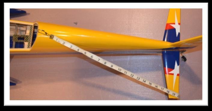 Measure the distance between the canopy latch and the corners of the horizontal stabilizer.