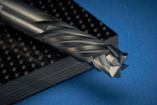This carbon fiber material is comprised of a layered resin structure with a variety of complex fiber configurations embedded within the resin giving the material its physical shape