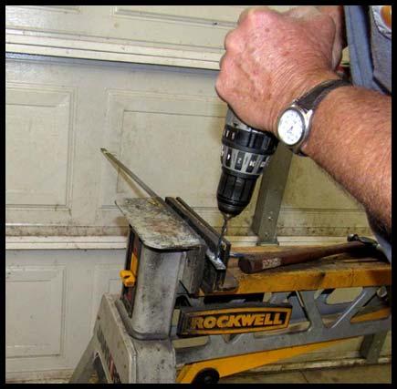 2. Using 1/2" x 1/8" x 1 1/2" steel strap, drill a hole approximately 3/8"