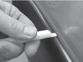 Edge Trim Tool Procedures: 41 42 Using supplied Edge Trim Tool (ET1-0002), seat edge trim against vehicle by hooking curved end under edge trim at one