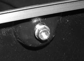 Remove four factory screws from the fender lip. Save screws for reinstallation.