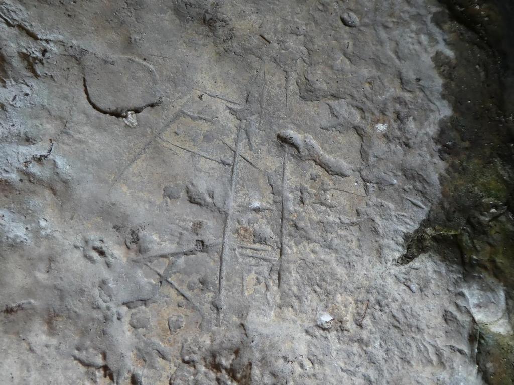 Panel 2 consists of approximately 12 deeply incised grooves located in the lower, west shelter near the active spring.