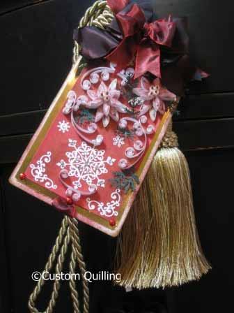 It is an oversize tag that is attached to a large tassel and hung from a doorknob or drawer pull for decoration.