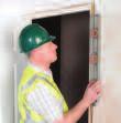 If a greater gap is required lift the frame using packers. If a smaller gap is required trim the bottom of the lining. Position the doorset vertically and centrally in the wall opening.