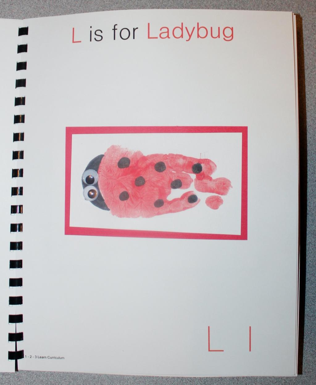 L is for Ladybug Paint the child s hand red, minus the thumb and place on white card stock. (You will want to keep the fingers together when placing on the white card stock).