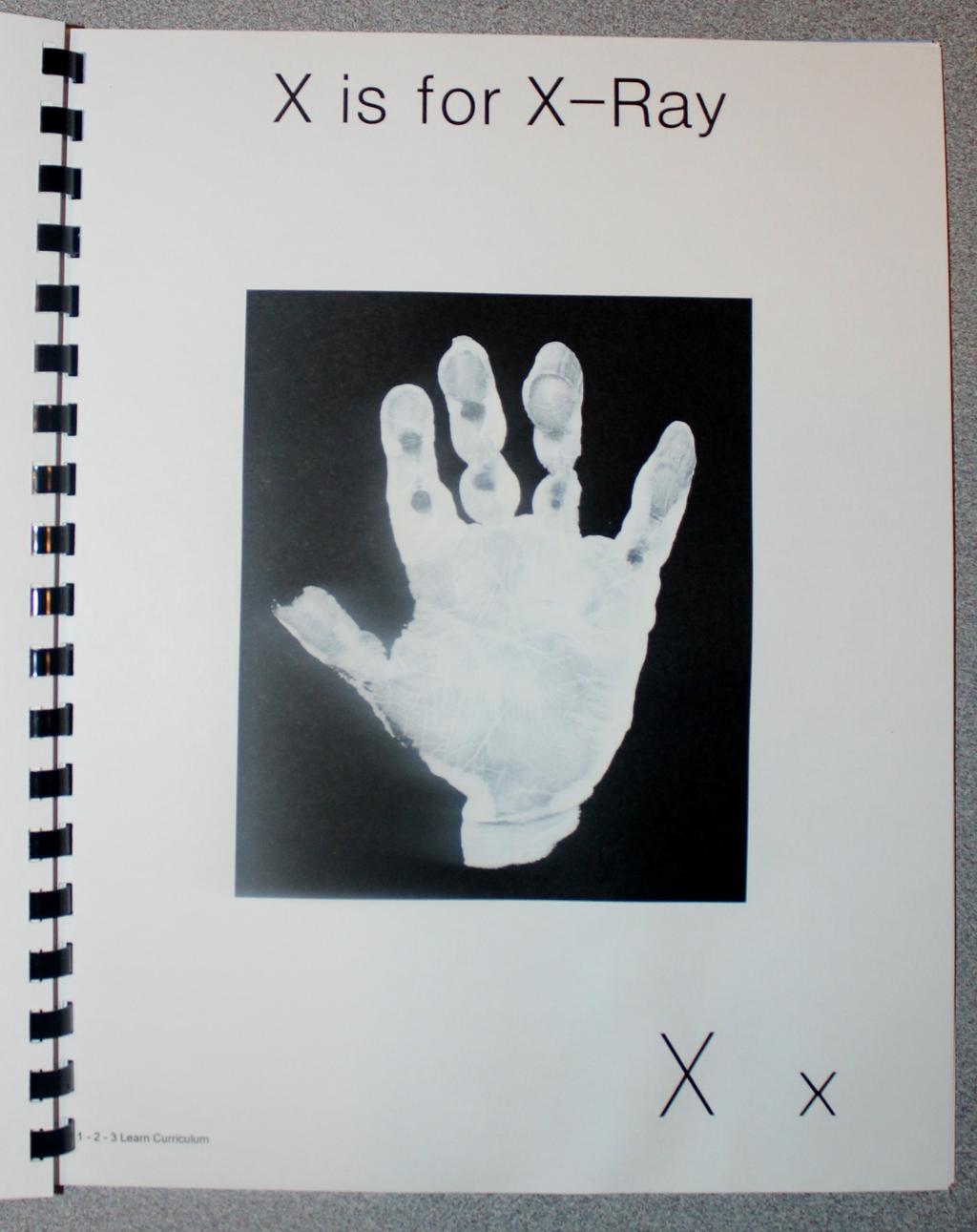 X is for X-Ray Paint the child s hand white and place on black card stock.
