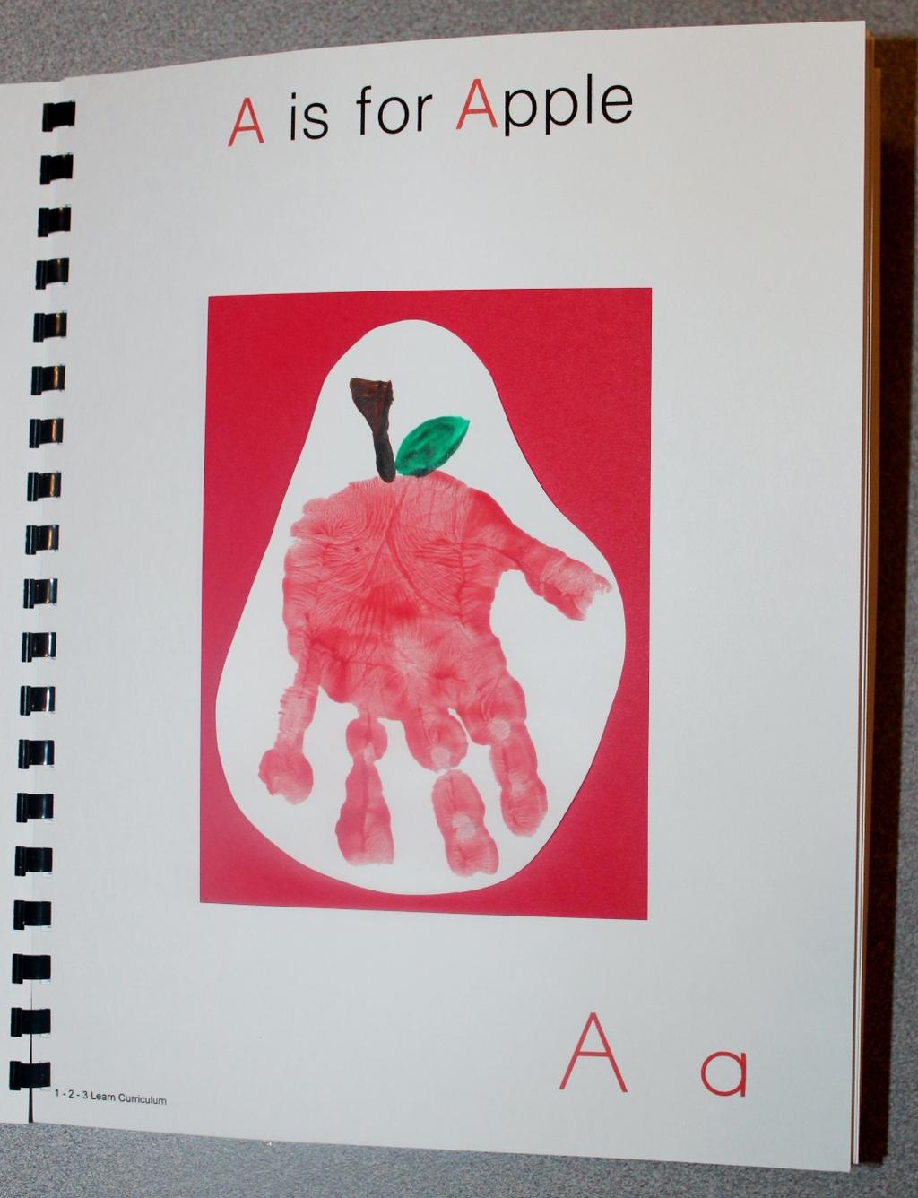A is for Apple Paint the palm of the child s hand red and place on white card stock. When dry, paint a brown stem and green leaf.