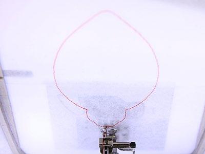 Attach the hoop to the machine and load the full embroidery design (not the dieline files).