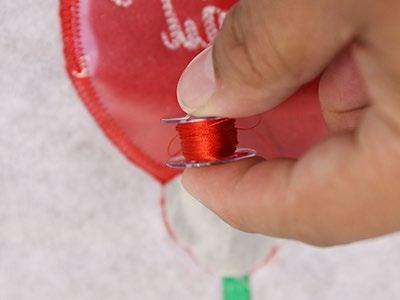 Since both sides of the ornament will be seen, wind a bobbin with the same