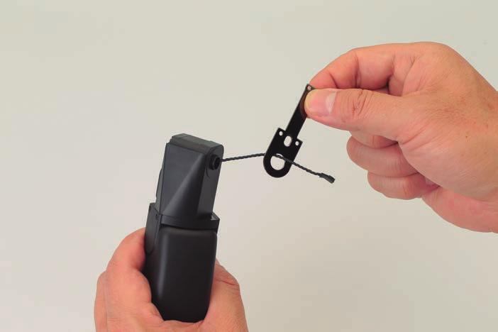 4 Keep holding the parts together with your finger and thumb, then pull the cable gently so that it is taut.