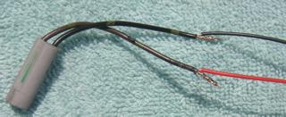 Wire as follows: Black Connector, (Right signal): green wire with yellow dots to red/yellow wire of Stealth.
