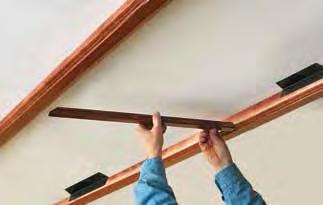 On the main beam, starting from the end that has the tongue, measure the distance from the wall to the first lag eye screw (see Step 5). Mark this point on the main beam.