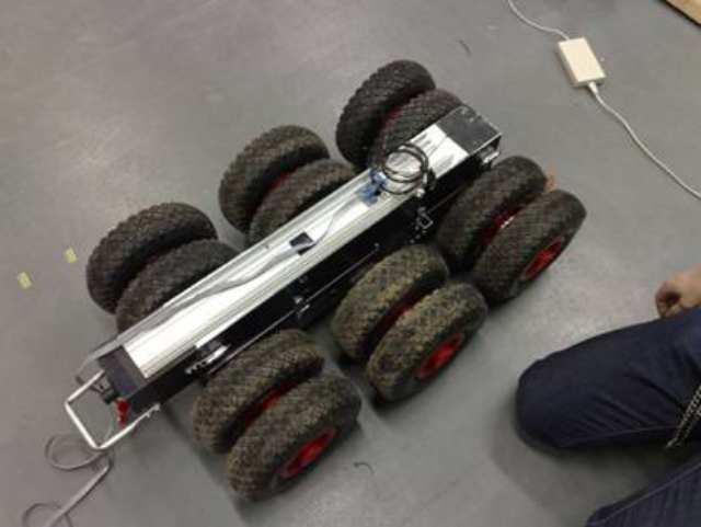 Figure 2: Modular base (left), multi-purpose platform pulling trailer (right) To gain easy and fast development, most of the robot s body parts are developed from standard 100x100mm 3mm thick