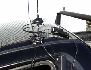 The photo shows the toroid and ferrite chokes on the roof for clarity. They are 'Gaffer' taped down to the side of the vehicle. An external antenna socket was fitted to the radio.