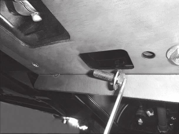 Insert the cap screw with handle inside the frame opening in each frame rail, and insert the fasteners down through the holes previously drilled in Step 5. 7.