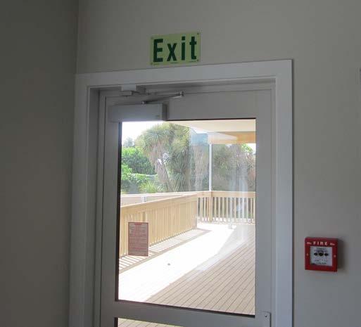 Surface Mounted Signs Mounting Location At doors: mount on a vertical surface within 600mm of the door where the sign is least likely to be obscured from view.