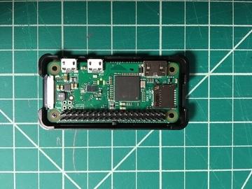 Place the Pi Zero inside of the bottom enclosure piece and snap in place. Push the Joy Bonnet over the headers on the Pi and firmly press in place.
