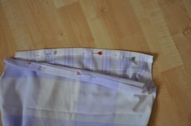 2) Cut along the closed end of the pillowcase to create another opening.