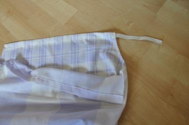 3) With the inside of the pillowcase/fabric facing you, fold down ¼ along the top of the dress