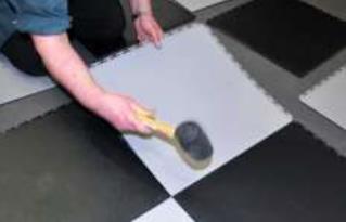 Fill any holes with a rapid setting floor repair compound such as Ardurapid A46 or similar. For uneven surfaces that require smoothing use a soothing compound such as Ardex Feather Finish.