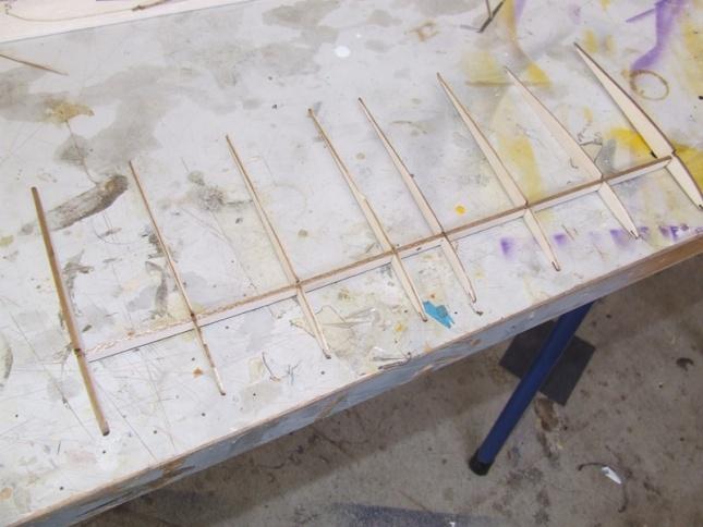 Locate all the pieces for the wing (the flat carbon, all the 1.5mm balsa sheets, and the main 3mm spars). 2.