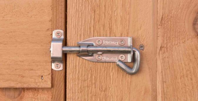 Step 18: Using 3 x 75mm tek screws, screw door stud to the panel. Check that door opens.
