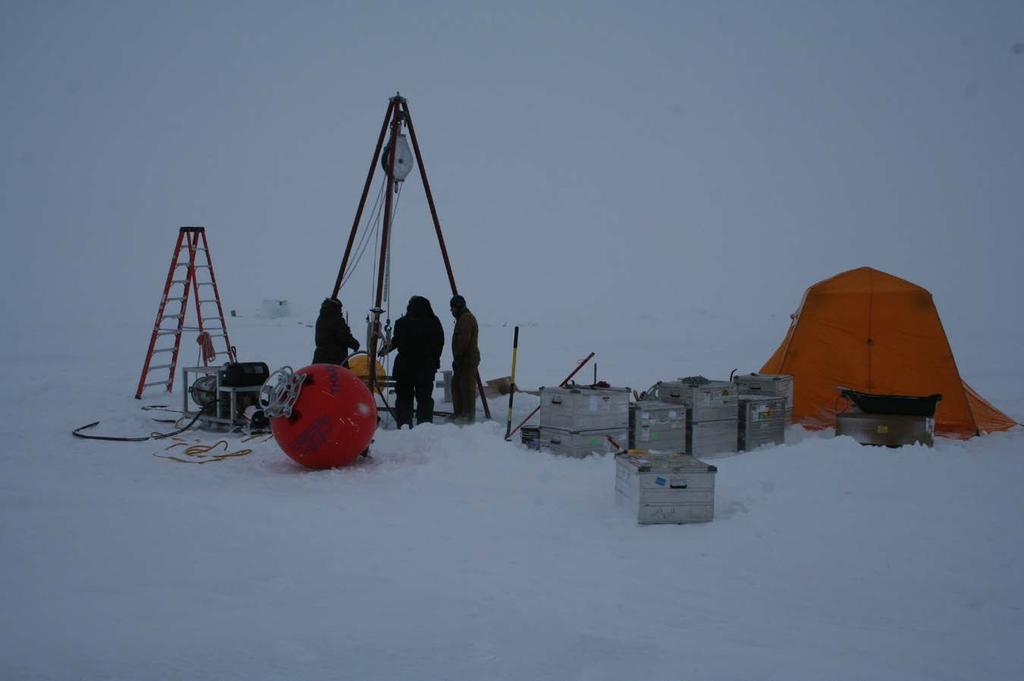Fig. 2. Deployment of the SIO-WHOI THAAW mooring at ice camp Barneo during 12 15 April 2013. (Photo: P. Worcester) The mooring was successfully recovered on 20 September 2013 at approximately 84º 02.