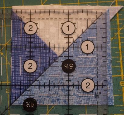 (7) Join two Quarter-square Triangles together, matching seams, as shown.