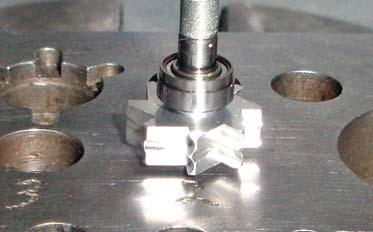 STEP 2 After-Market Turbine Only: Place a new KaVo bearing, face down, into Hole #2 on your work block. Next, insert the front (open end) of the spindle into the bearing.