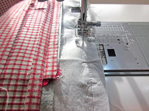 6. Fold the waistband and bib up into position and press well, pressing the seam allowance up toward the waistband.