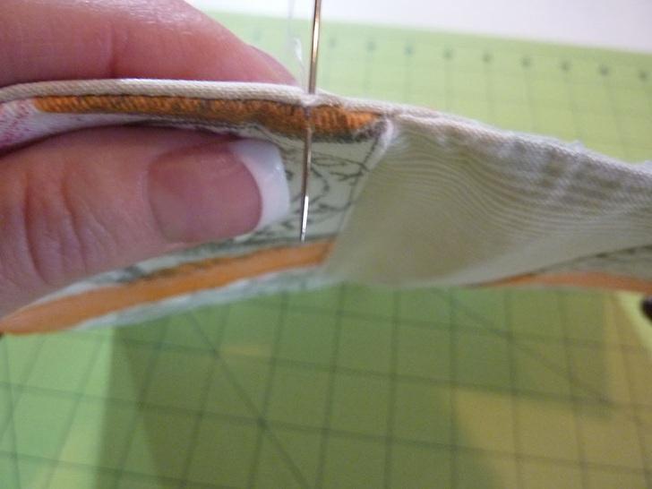 5. Thread the hand sewing needle with thread to best match both the exterior and interior fabrics and slip stitch the opening closed. 6. Press flat again. 7.