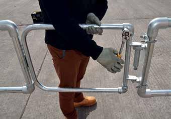 Disconnect the tubular gate from the hinge assembly by loosening the top & bottom cast clamp
