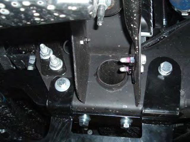 Reinstall the 7/16 x 5 bolt with flat washers (2ea), lock washers and nuts.