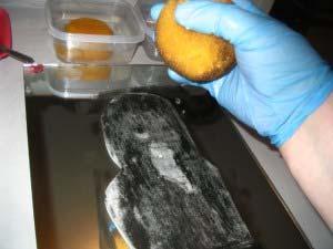 Lightly sponge up the excess water from the image and pat dry over top of the image in the