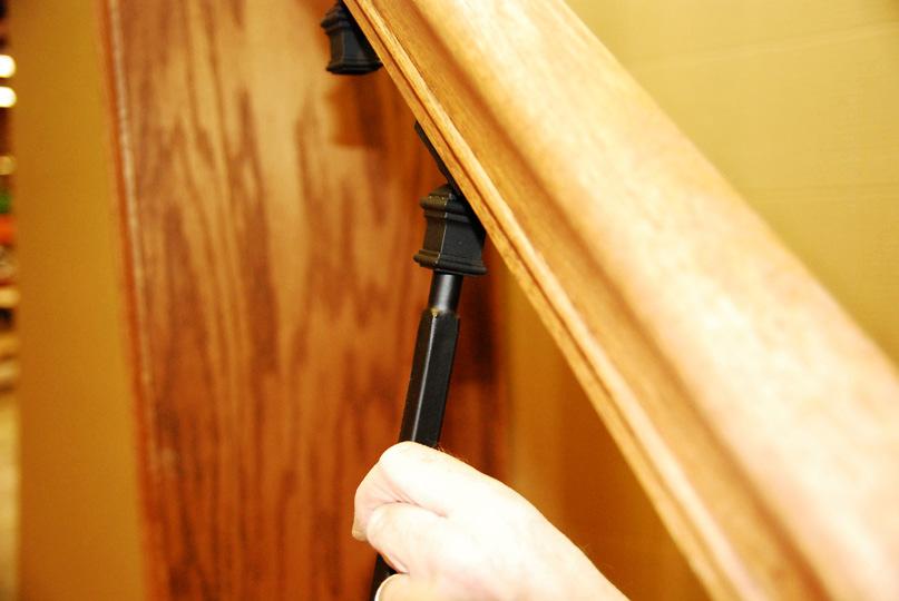 Step 6) Tilt the Ball Adaptor out and insert the pin top end of the Iron Baluster.