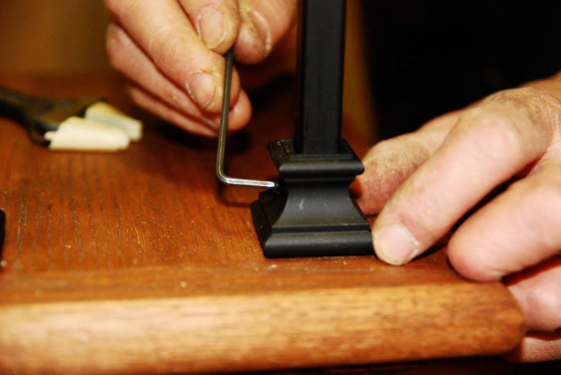 ) (See Photo #29) Photo #29 Step 10) Tighten the set screw for the bottom of the Iron Baluster within the Base Collar.