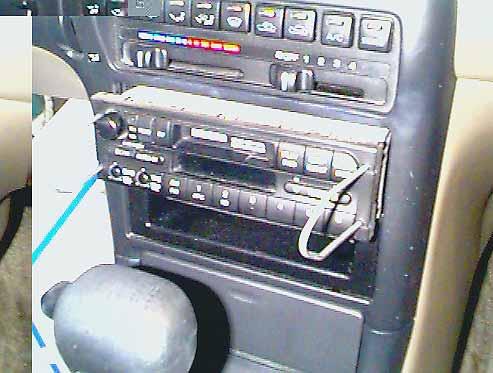 Factory Radio STEP 1: The Mazda radio is snapped into the vehicles dash. With the proper tool, known as Mazda radio removal keys, the Mazda radio can be pulled forward out of the dash.