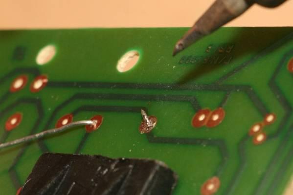 Repeat de-soldering as needed until all solder is removed.
