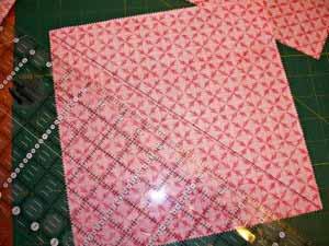 Be careful not to stretch the fabric as you mark it Layer a light square and a dark square, right