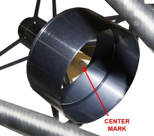With the laser mounted in the focuser, the red dot should hit the secondary mirror inside the center of the center mark. Adjust the set screws as described above if necessary.
