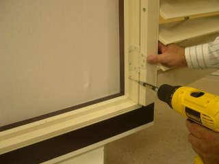 9. Once panel has been positioned and secured with the hinge pins, make sure shutter panel is