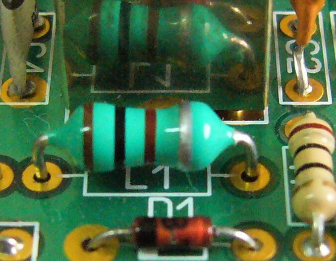 Axial inductors L1, L2, L3, L4 L5, L7, L9 These components look just like fat resistors, but they have a blue or green background bodies. Inside the device is a small coil wound on ferrite material.