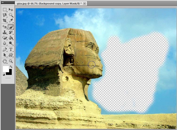 So now we want to bring back the sand and part of the face. No problem. Layer masks are not destructive so just change the color to WHITE, click on the X to switch the colors.
