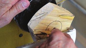 Align the parting tool with the ways below to ensure a cut that is perpendicular to the face of the blank.