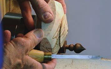 To remount the lid so you can complete its top surface, true up the remainder of the blank still in the scroll chuck, and make it into a jam chuck by cutting a tight recess for the lid tenon.